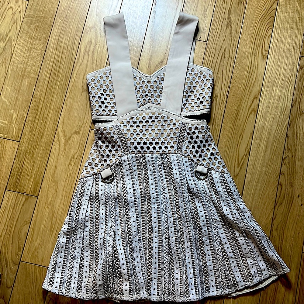 SELF PORTRAIT mini dress with cutouts.